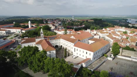 The-cathedral-of-our-lady-of-the-conception-in-santarem,-portugal-on-a-sunny-day,-aerial-view