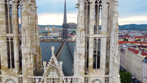 Drone-flies-from-left-to-right-near-Neo-Gothic-building-in-Vienna,-Austria