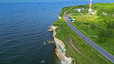 Aerial-drone-top-down-shot-over-a-beautiful-limestone-cliff-slowly-eroding-away-in-Paldiski,-Estonia-at-daytime