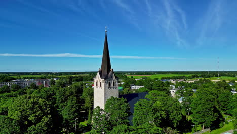 Keila-Church-Tower-During-Summer-In-Estonia---Aerial-Drone-Shot