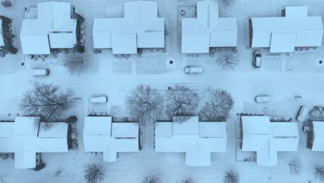 White-snow-covered-roofs-of-homes-in-american-neighborhood