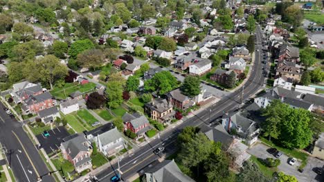 Aerial-approaching-shot-of-american-downtown-with-cars-on-junction