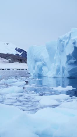 Iceberg-Ice-Formation-Close-Up-Detail-in-Antarctica,-Vertical-Nature-Video-for-Social-Media,-Instagram-Reels-and-Tiktok-of-Sea-Ice-and-Icebergs-Amazing-Beautiful-Patterns-in-Antarctic-Peninsula-Ocean