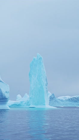 Big-Iceberg-Ice-Formation-in-Ocean-Sea-Water,-Large-Amazing-Shapes-Bizarre-Icebergs-in-Antarctica-Scenery-Vertical-Video-for-Social-Media,-Instagram-Reels-and-Tiktok,-Antarctic-Peninsula-Landscape