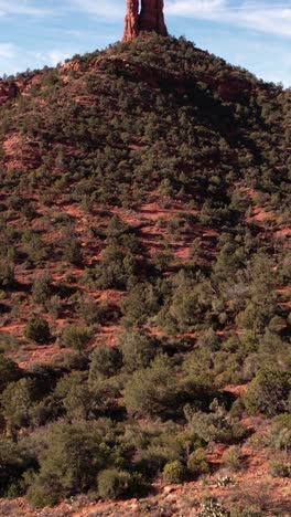 Sedona,-Arizona-USA,-Vertical-Aerial-View-of-Chimney-Rock,-Sandstone-Spire-Formation-and-Desert-Landscape,-Revealing-Drone-Shot