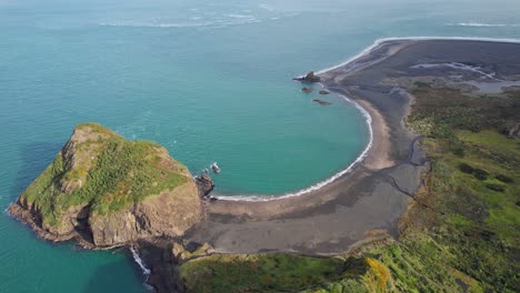 Paratutae-Island,-Ninepin-Rock-At-Whatipu-Beach-In-New-Zealand---Aerial-Drone-Shot