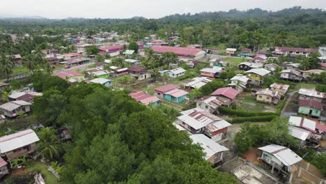 Almirante,-panama,-showcasing-vibrant-houses-surrounded-by-lush-greenery,-aerial-view