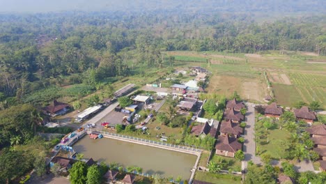 Orbit-drone-shot-of-"Balkondes-Wanurejo"-and-Junkyard-Park