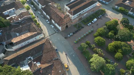 Aerial-View-Roldanillo-Town-Park-Ermita-Chapel-Orbit-Left-at-Sunset