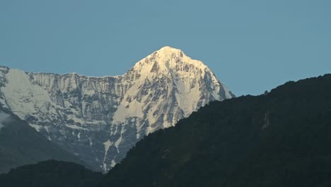 Massive-High-Altitude-Snowy-Mountain-Peaks,-Big-Snowcapped-Mountain-Top-in-the-Annapurna-Region-of-Nepal-while-Trekking-and-Hiking-on-the-Annapurna-Circuit-in-Nepal