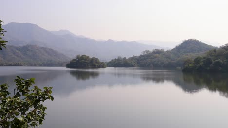 misty-mountain-landscape-with-pristine-lake-at-day-from-flat-angle