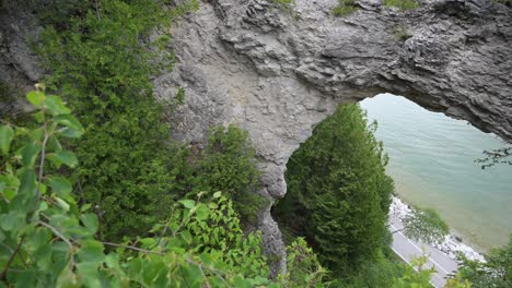 arch-rock-and-below-in-Mackinac-Island,-Michigan,-biking-trail-around-the-island-below-the-arch