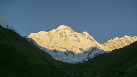 Himalayas-Mountains-Sunrise-Timelapse,-Nepal-Time-lapse-of-Beautiful-Scenery-and-Shadow-Moving-with-Sun-Rising-on-Snowcapped-Winter-Mountain-Top-Peaks-and-Summit,-Amazing-Landscape-in-Nepal