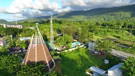 PLBN-Skouw-or-the-border-post-between-Indonesia-and-Papua-New-Guinea-is-very-beautiful-with-clouds-and-blue-sky-and-the-expanse-of-the-ocean,-there-is-a-unique-church-with-a-cone-shape