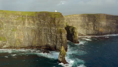 Stunning-aerial-pan-of-the-Cliffs-of-Moher-showcasing-O'Brien's-Tower-and-the-famous-sea-stack