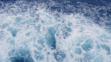 Waves-From-The-Bow-Of-A-Cruise-Ship-Sailing-On-A-Blue-Sea