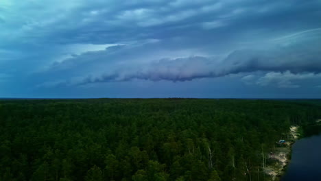 A-dark-evening-drone-panoramic-reveals-delta-fields,-white-sand-coastline-ocean