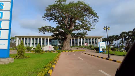 Scenic-view-of-Sir-DK-Jawara-international-conference-centre-building-from-entrance-through-car-window