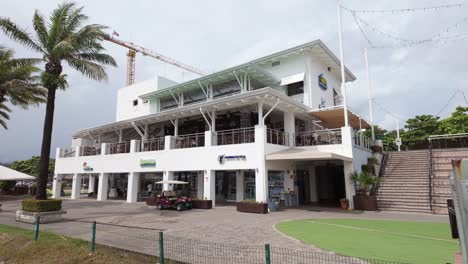 Terraced-bar-and-restaurant-with-accessory-marine-shops-and-services-located-inside-the-Marina-Pez-Vela-in-Quepos,-Costa-Rica