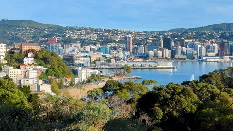 Beautiful-panoramic-landscape-view-of-Wellington-capital-city-with-yachts-sailing-on-harbour,-skyscrapers-and-houses-in-New-Zealand-Aotearoa