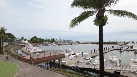 Side-of-the-Marina-Pez-Vela-with-docked-vessels-and-boat-under-maintenance-taken-out-of-water-in-Quepos,-Costa-Rica