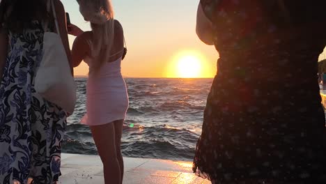 Zadar,-Croatia-sunset-watching-with-people-and-wavy-sea