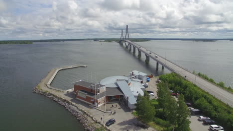 Drone-shot-of-Replot-Bridge-of-Raippaluoto-and-Berny's-Cafe,-located-in-western-Finland-by-the-sea