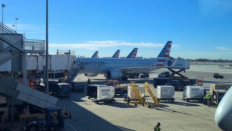 Los-Angeles-USA-LAX-Airport,-American-Airlines-Airplanes-and-Spirit-Airline-Plane-Taking-Off-From-Runway