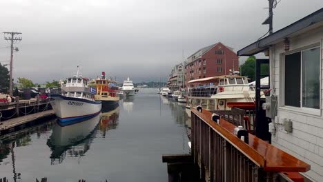 Establishing-shot-of-Portland,-Maine-working-waterfront-with-boats-and-condos