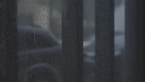 real-rain-drops-sliding-on-window-glass,-c-log-raw-color,-4k