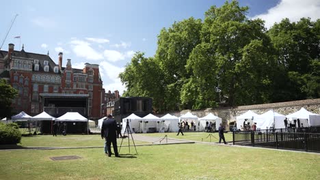 Press-tents-and-camera-crews-set-up-for-an-event-in-Abingdon-Street-Gardens,-Westminster