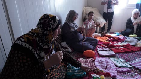 Women-at-the-Darashakran-Refugee-Camp-knitting-handicrafts-to-sell-for-income