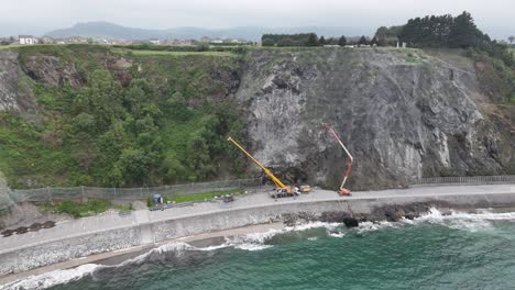 Rock-face-Cliff-repairs-Luarca-Asturias,-northern-Spain-drone,aerial