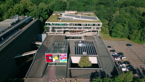 Aerial-footage-provides-a-sweeping-view-of-the-public-broadcasting-building-housing-BNNVARA,-VPRO,-HUMAN,-and-NTR-in-Hilversum