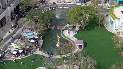 Aerial-view-of-people-walking-around-courtyard-at-The-Americana-at-Brand-shopping-center,-Glendale,-California