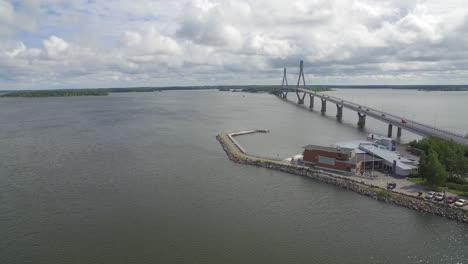 Drone-shot-of-Replot-Bridge-of-Raippaluoto-and-Berny's-Cafe,-located-in-western-Finland-by-the-sea