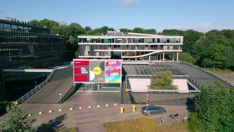 Drone-footage-showcases-exterior-of-Dutch-Public-Broadcasting-media-studio-complex-at-Media-Park-in-Hilversum