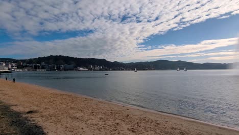 Scenic-view-of-Wellington-harbour,-water-fountain,-beach-and-waterfront-at-Oriental-Bay-in-capital-city,-New-Zealand-Aotearoa