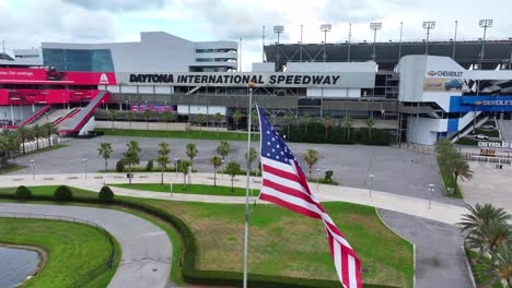 American-flag-waving-at-Daytona-International-Speedway,-home-of-the-Daytona-500-NASCAR-race