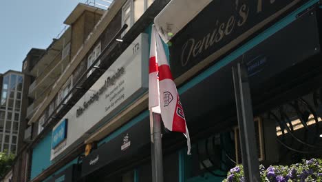 British-Flag-outside-Denises-Flowers,-Great-Suffolk-Street,-London-United-Kingdom