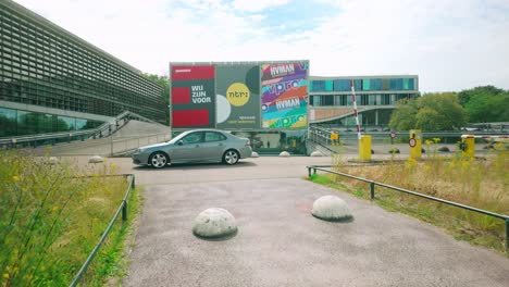 Footage-captures-the-exterior-of-BNNVARA,-NTR,-and-VPRO-offices-at-Media-Park-in-Hilversum,-showcasing-modern-architecture-and-the-vibrant-media-environment