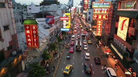 aerial-view-of-China-town-at-night,-Main-Street-with-neon-sign,-food-stalls,-tourists-and-traffic