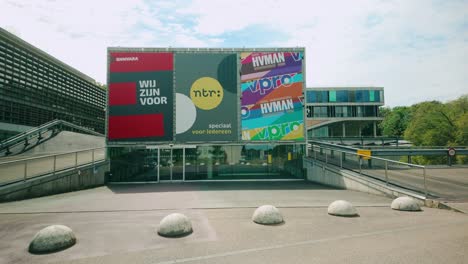 Footage-features-the-broadcast-headquarters-of-BNNVARA,-VPRO,-and-NTR-at-Media-Park-in-Hilversum,-highlighting-the-modern-architecture-and-dynamic-media-environment