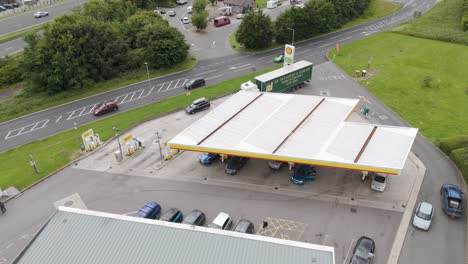 Aerial-view-of-Shell-Petrol-Station-and-surrounding-area-in-Okehampton,-Devon,-UK,-captured-in-July-2024