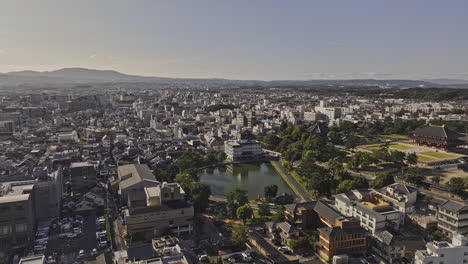 Nara-Japan-Aerial-v6-drone-flyover-Takabatakecho,-around-Sarusawa-ike-pond-capturing-downtown-cityscape,-Buddhist-temples-and-parks-in-Noboriojicho-area---Shot-with-Mavic-3-Pro-Cine---October-2023