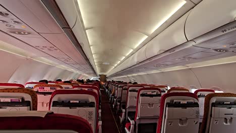 Many-people-are-seen-sitting-on-different-seats-in-the-plane