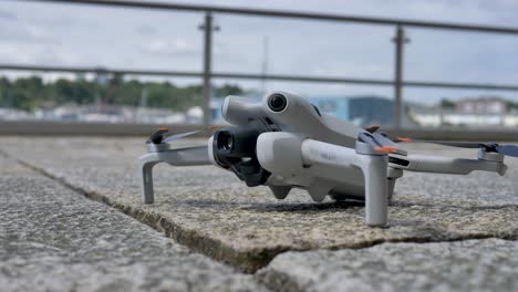 DJI-Mini-4-pro-drone-takes-off-Plymouth-Devon-UK,-July-2024