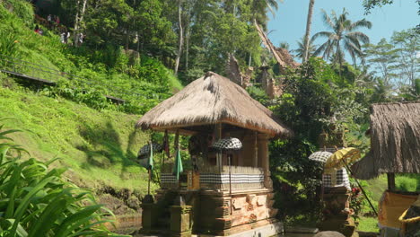 Small-Temple-In-Pond-By-The-Hillside-In-Alas-Harum-Bali,-Tegallalang,-Bali,-Indonesia