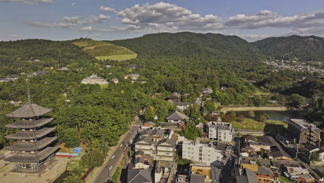 Nara-Japan-Aerial-v7-drone-flyover-Takabatakecho-and-Noboriojicho-towards-Kasuganocho-capturing-Buddhist-Temples,-parks-and-hillside-mountain-landscape---Shot-with-Mavic-3-Pro-Cine---October-2023