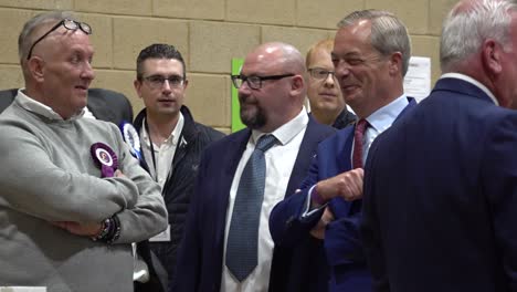 Nigel-Farage-and-other-candidates-wait-together-for-the-general-election-result-announcement-in-Clacton,-Essex,-UK